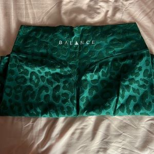Green size large balance athletica rider shorts.
